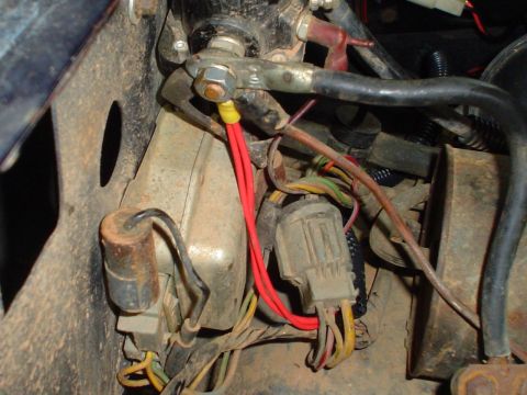 1984 Ford Bronco - Close-up view of the engine wiring harness, showing connections and various colored wires.