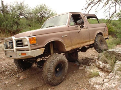 1989 Ford Bronco - This lifted 1989 Ford Bronco navigates a rocky off-road course.