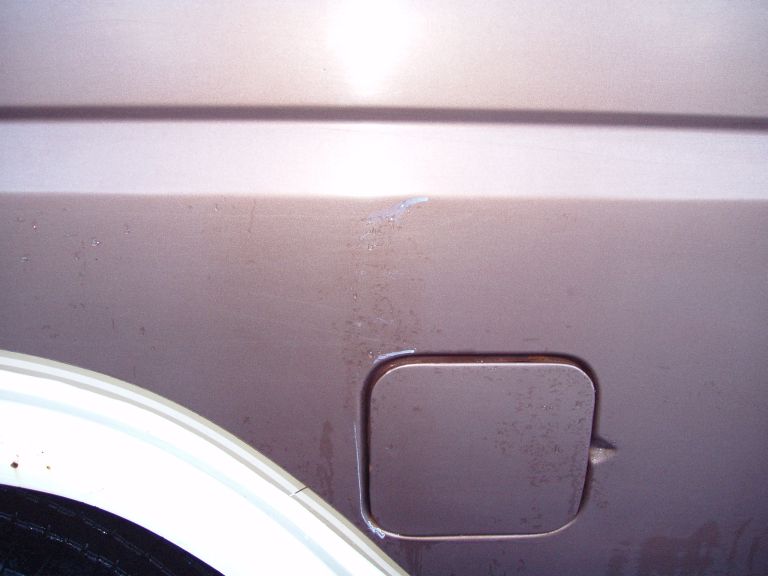 A nice white scuff mark left on my truck by a  full size Dodge van that decided he wouldnt be careful with his doors.