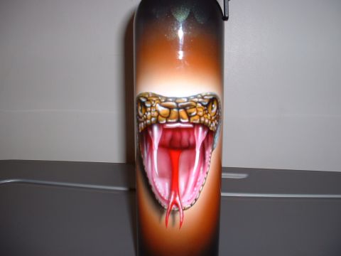 1978 Ford Mustang II - This object features an airbrushed snake head with its mouth open and tongue out.