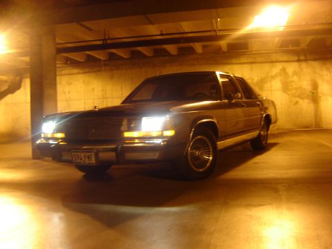 1988 Ford Crown Victoria LTD - A 1988 Ford Crown Victoria LTD is seen from a 3/4 front angle in a parking garage at night.