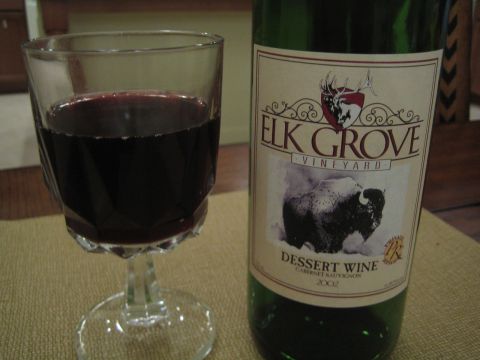 1968 Ford Mustang - A glass of red wine sits beside a bottle of Elk Grove Vineyard Cabernet Sauvignon from 2002.