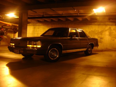 1988 Ford Crown Victoria LTD - A 1988 Ford Crown Victoria LTD is seen from a three-quarter front view in a parking garage.