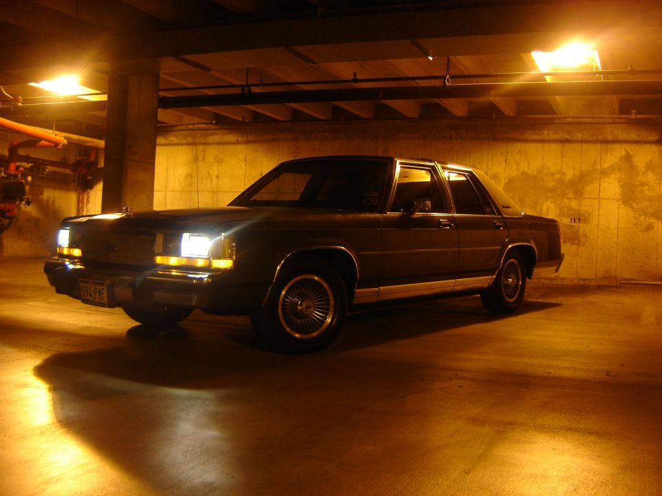 1988 Ford Crown Victoria parked in a dimly lit garage