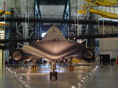 1994 Ford Bronco - An SR-71 Blackbird aircraft is displayed indoors with other aircraft hanging above.