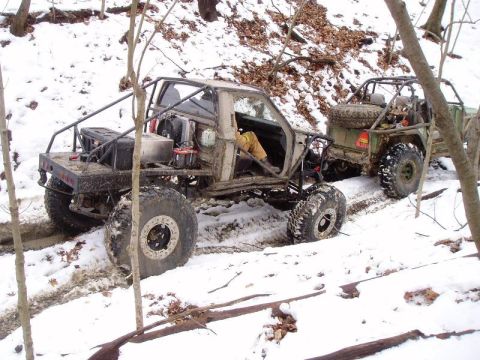 1992 Ford Bronco - These custom off-road vehicles are tackling a challenging snowy terrain, their capabilities.