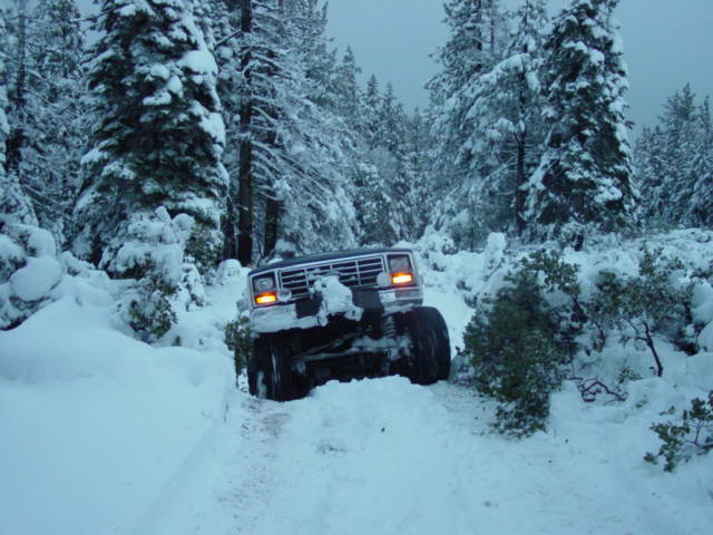 1986 Ford Bronco driving through snow