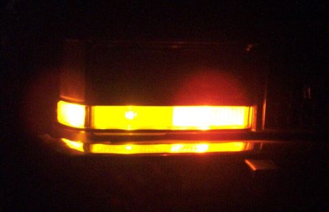 1985 Ford LTD Crown Victoria - Illuminated front turn signal and parking light assembly, likely from a car or truck.