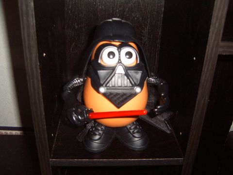 1988 Ford Bronco - Darth Vader Mr. Potato Head toy with lightsaber, displayed on a shelf.