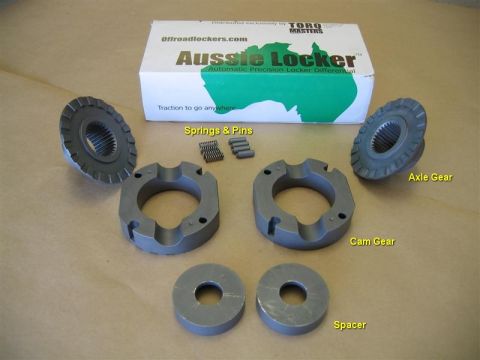 1993 Ford Bronco - Differential parts are laid out on a surface with a box labeled 'Aussie Locker' in the background.