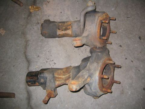1978 Ford Bronco - Pair of rusty front axle knuckles, possibly for a 4x4 vehicle.