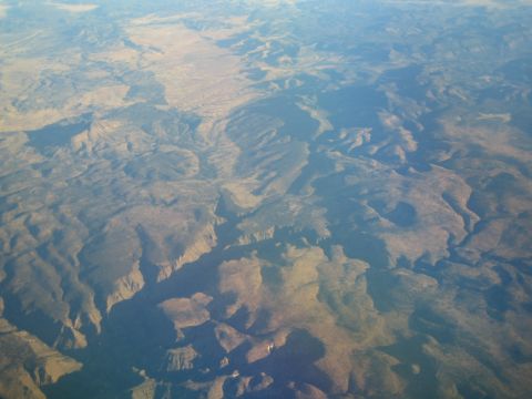 1968 Ford Mustang - An aerial perspective reveals the terrain of a dry, mountainous region.