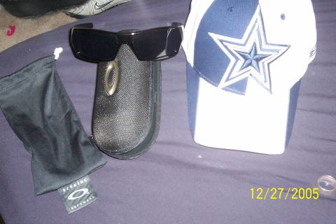 1995 Ford Bronco - A pair of Oakley sunglasses and a Dallas Cowboys cap are displayed on a purple surface, with a date stamp of 12/27/2005.