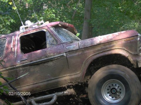 1978 Ford Bronco - This 1978 Ford Bronco is deep in the mud, likely stuck during an off-road excursion.