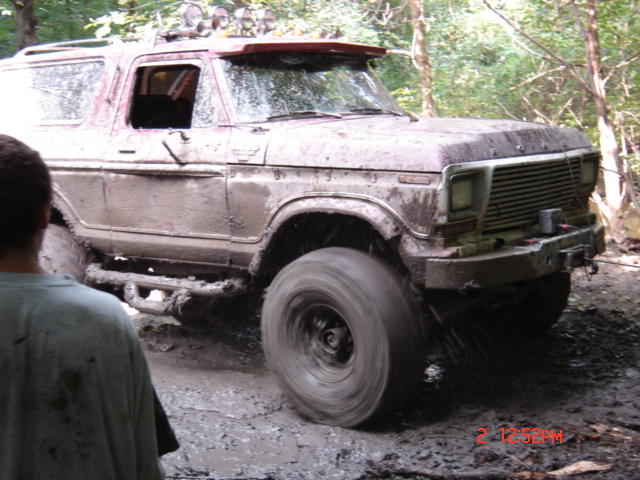 Muddy 1978 Ford Bronco with off-road lights