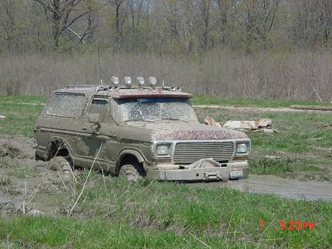 1978 Ford Bronco - This 1978 Ford Bronco is deep in the mud, with its roof lights on.