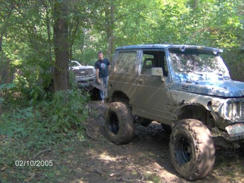 1978 Ford Bronco - Two off-road vehicles are stuck in the mud on a wooded trail. The date stamp reads 02/10/2005.