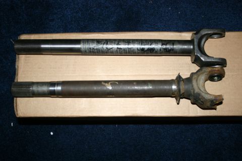 2003 Jeep TJ - Two axle shafts are shown, one appearing newer than the other.