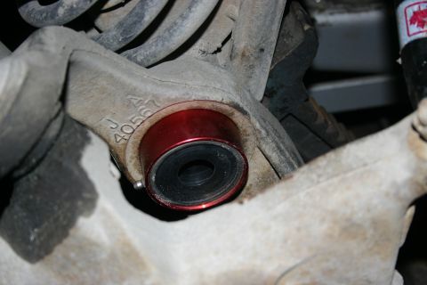 2003 Jeep TJ - Suspension bushing with part number J A 40567 visible on the bracket.