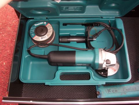 1993 Ford Bronco - Angle grinder and cutting discs are neatly organized in their teal plastic carrying case.