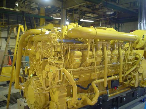 1966 International School Bus - This is a large yellow industrial engine, not a 1966 International School Bus.
