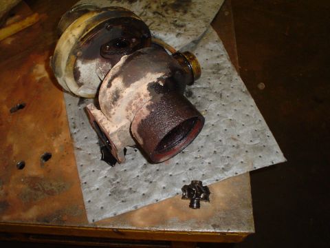 1966 International School Bus - Disassembled turbocharger and wastegate actuator components resting on a shop towel.