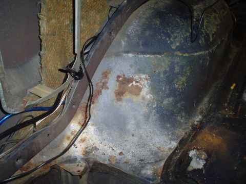 1984 Ford Bronco - The interior panel shows significant rust and damage, with loose wiring visible.