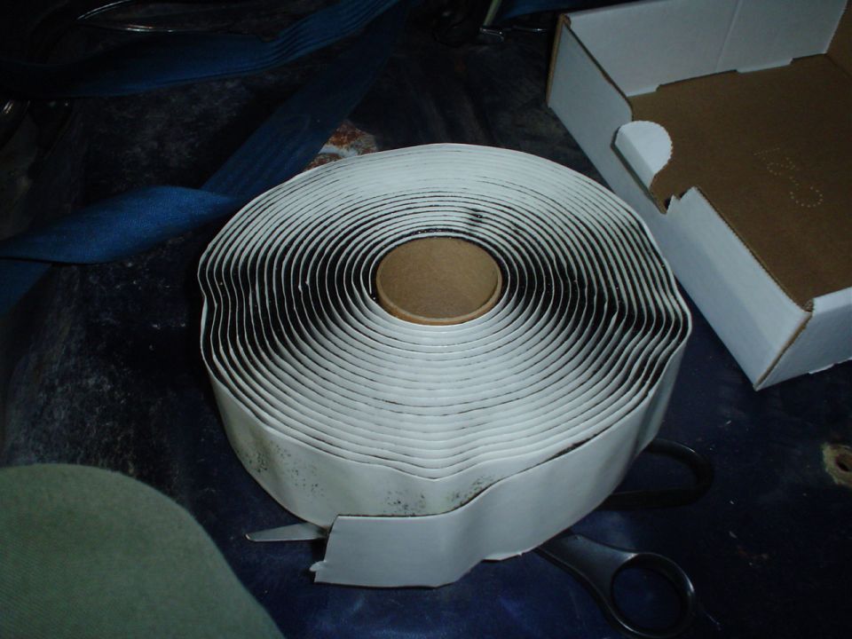 Roll of butyl tape with scissors nearby