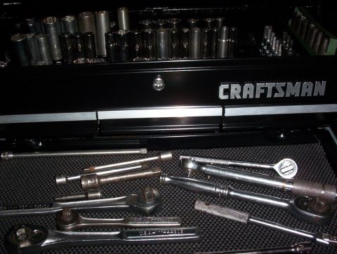 1993 Ford Bronco - A collection of sockets and wrenches are organized within a Craftsman tool chest.