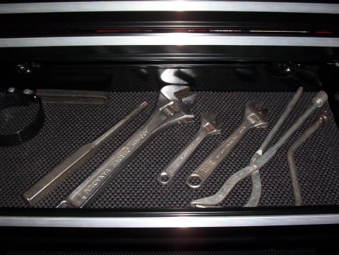 1993 Ford Bronco - A collection of various tools are organized within a toolbox drawer.