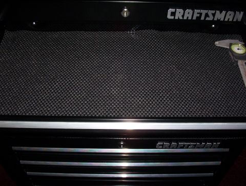 1993 Ford Bronco - A black Craftsman toolbox is shown with a textured surface and a caliper resting on the top right corner.