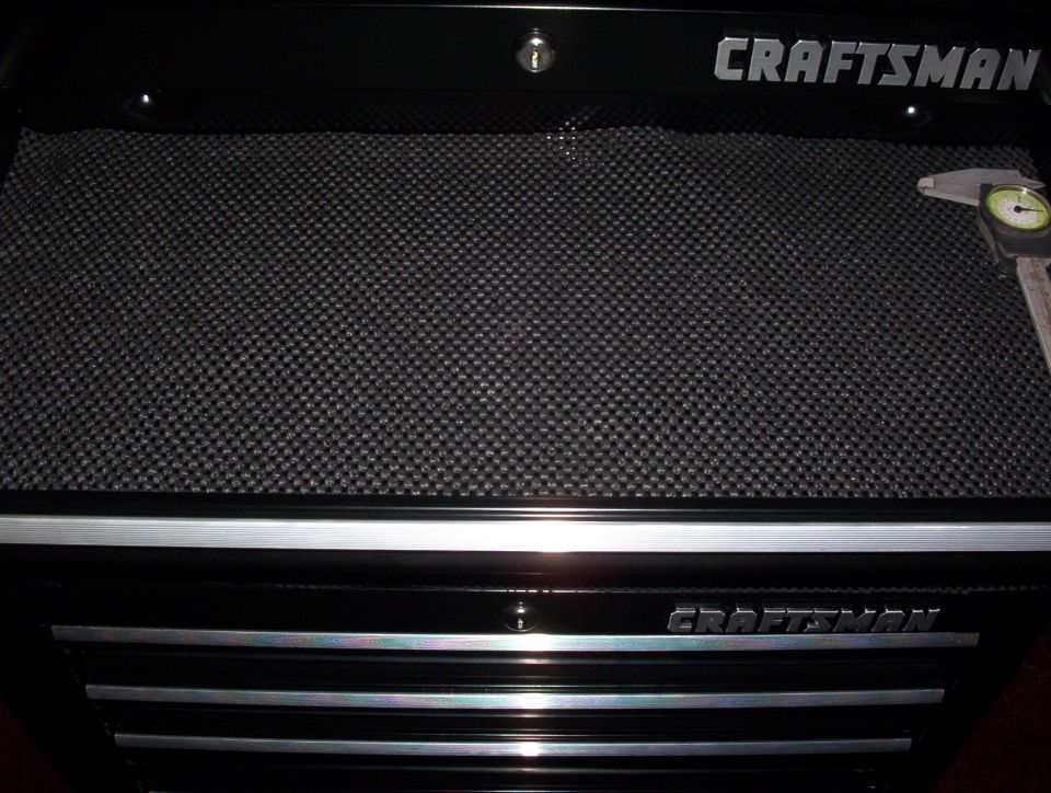 Black Craftsman toolbox with textured surface and caliper