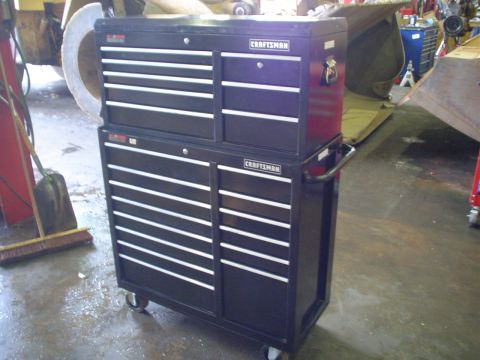 1966 International School Bus - A black Craftsman rolling tool chest is shown in a workshop setting.