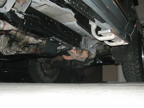 1989 Ford Bronco - Undercarriage view showing running boards and frame components, not the full vehicle.