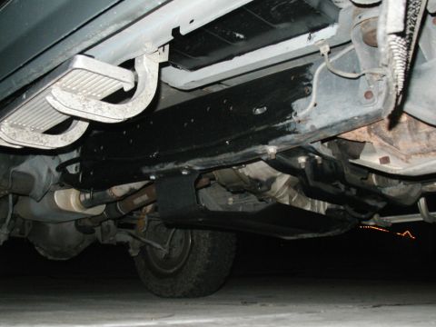 1989 Ford Bronco - This photo shows the undercarriage of a vehicle, including the frame, running boards, and drivetrain.