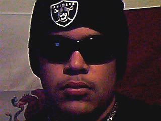 1980 Ford Bronco - A person is shown wearing a beanie and sunglasses, with a logo on the beanie.