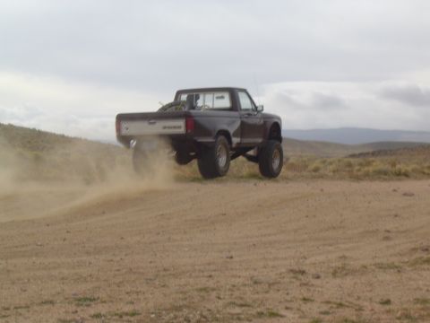 1985 Ford Ranger - Lifted 1985 Ford Ranger driving off-road and kicking up dust.