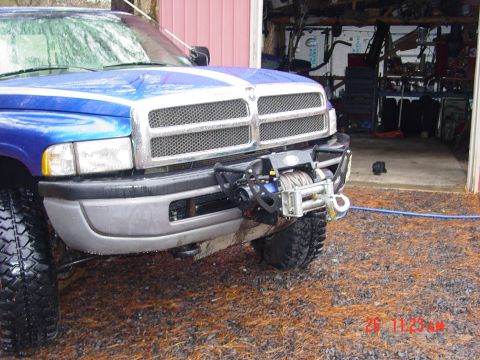 1995 Dodge 1500 - Blue Dodge pickup truck with aftermarket winch and bumper modification.