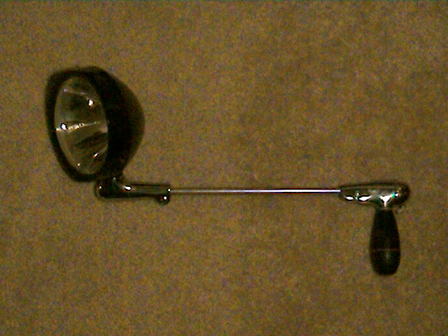 spotlight with black housing and chrome arm