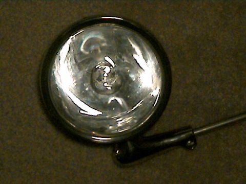 1977 Ford F-150 - A close-up view of a single headlight assembly, likely an aftermarket accessory.