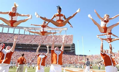 1993 Ford Bronco - A group of cheerleaders are performing a stunt during a sporting event.