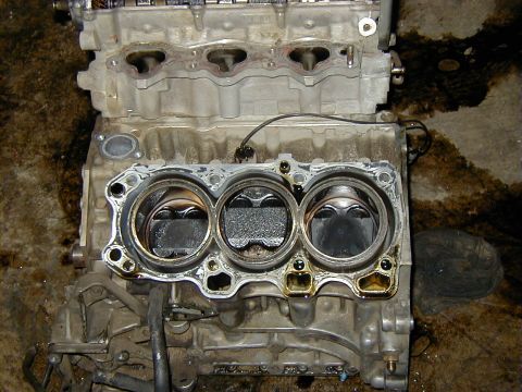 1995 Ford Probe - Missing chuck of piston and ring poking up through the hole.