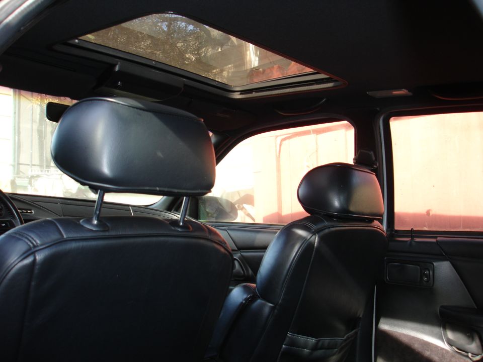 Black leather seats and sunroof in a 1992 Ford Taurus interior