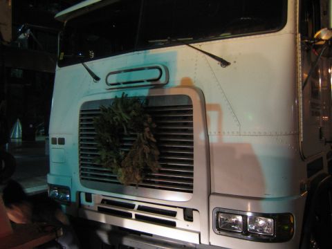 1968 Ford Mustang - A white semi-truck's grille is adorned with a festive wreath.