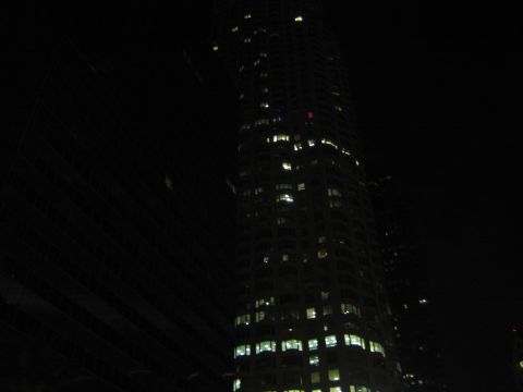 1968 Ford Mustang - A nighttime view of a tall building with lights on in many windows.
