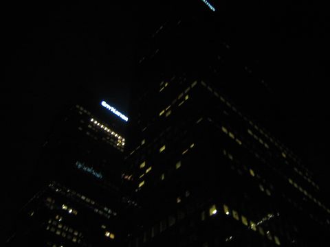 1968 Ford Mustang - A nighttime view of a city building, illuminated windows and a prominent "CITY NATION" sign.