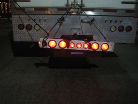 1968 Ford Mustang - Rear view of a trailer's illuminated tail light assembly.