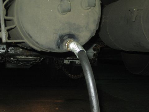 1968 Ford Mustang - Detail of air brake tanks and a connected hose, likely on a commercial truck.