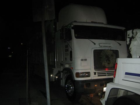 1968 Ford Mustang - A white semi-truck is parked at night, with a wreath visible on its grille.