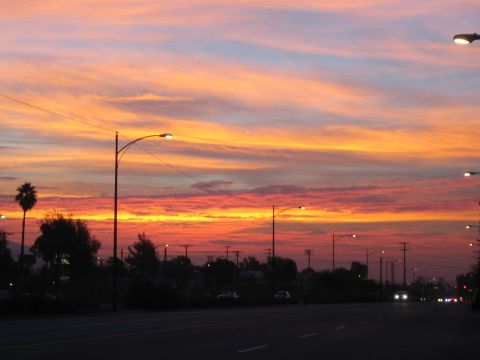 1968 Ford Mustang - A highway scene at dusk with streetlights and a colorful sunset.